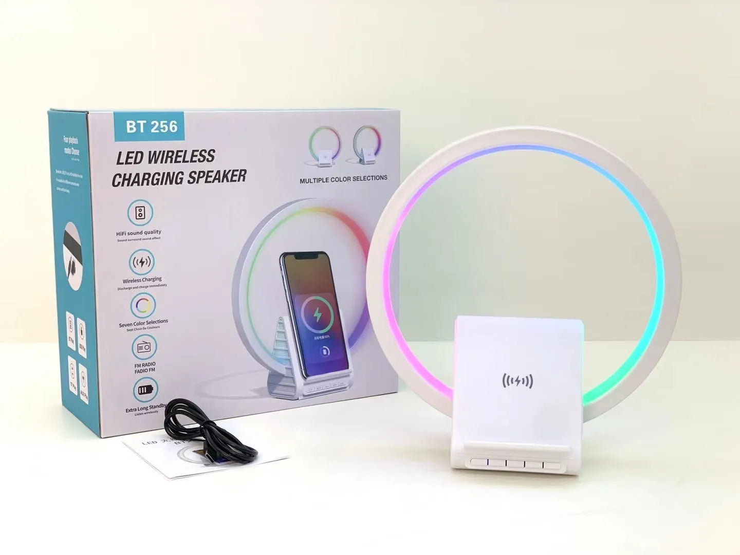 White square Bluetooth speaker with wireless charging pad and ambient LED light on top