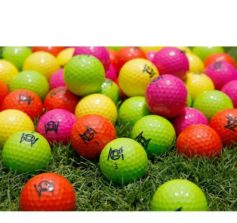Golf Color Game Ball two-layer practice ball in orange, yellow, green, and rose colours, 42.6mm diameter