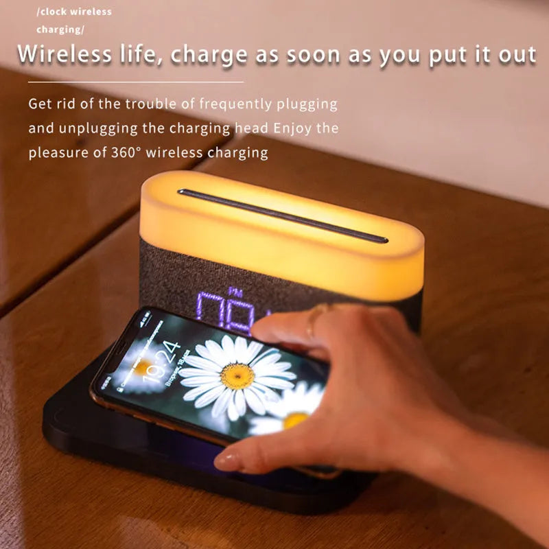 Modern black and white wireless charging desk clock with integrated night light and table lamp.