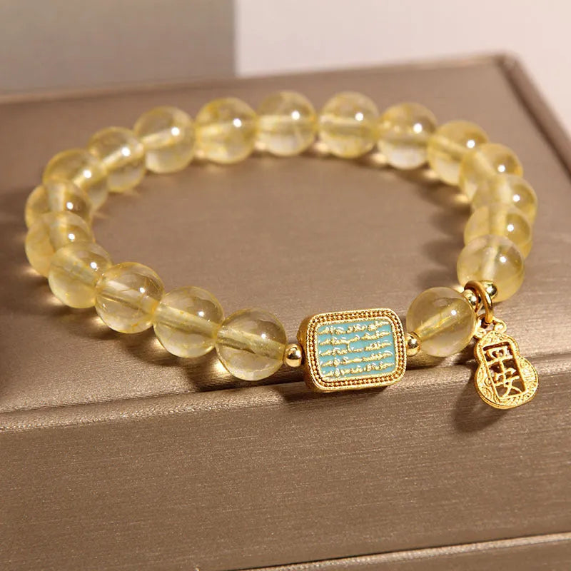 Women's citrine crystal bracelet with rhinestone decorative details showing natural yellow colour