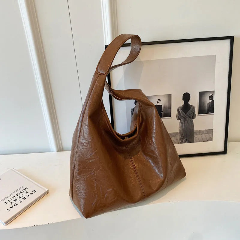 Casual soft leather shoulder bag with large capacity and sandwich pocket in street trend style