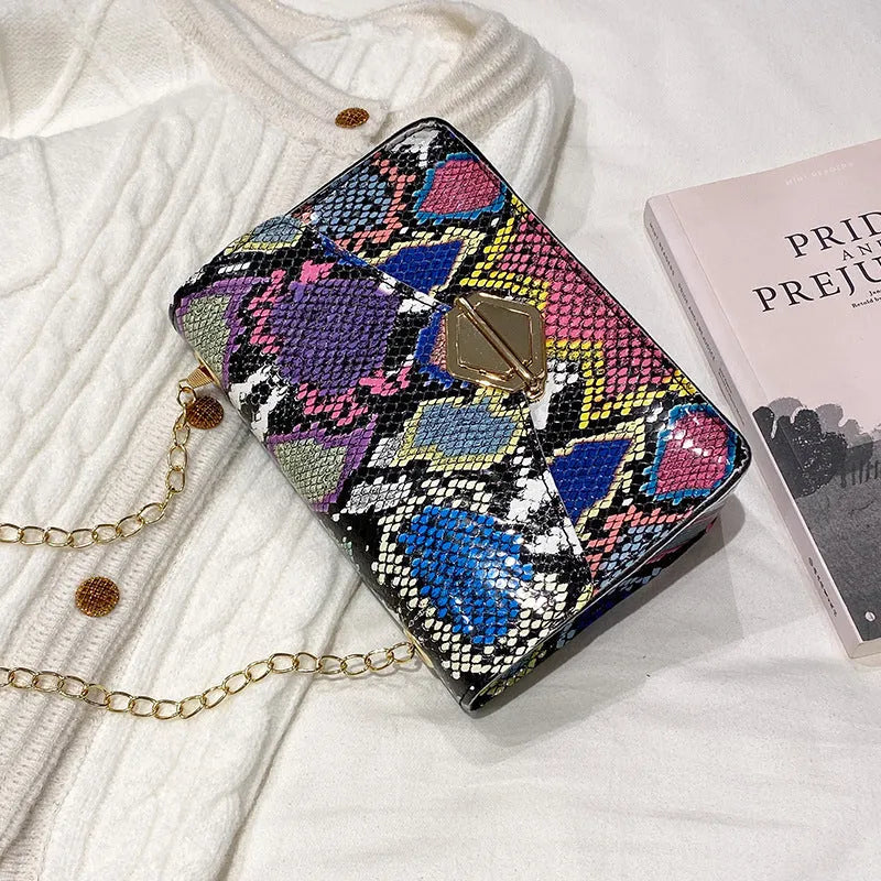 Rainbow Cloud Mist chain bag in light gray, clamshell opening, horizontal square shape, snake chain detail