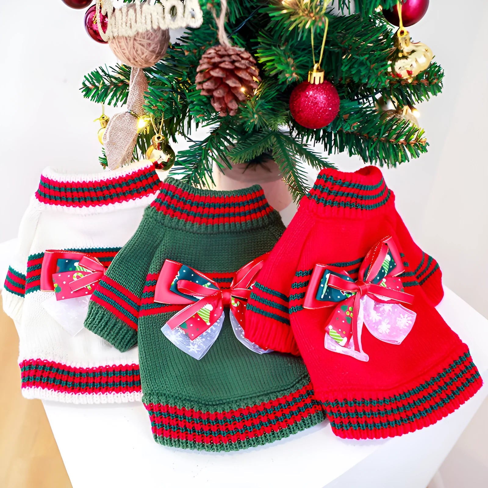 Red polyester Christmas dog jumper on small dog showing festive patterns and pullover design