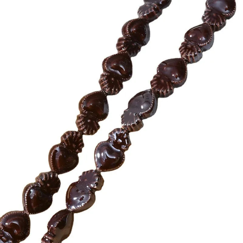 Ceramic heart torch beads in various colours for jewellery making, approximately 10mm by 15mm with straight hole