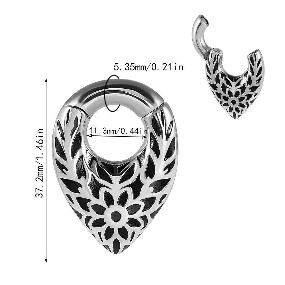 Stainless steel drop-shaped ear extender with round hanging egg and totem pattern detail.