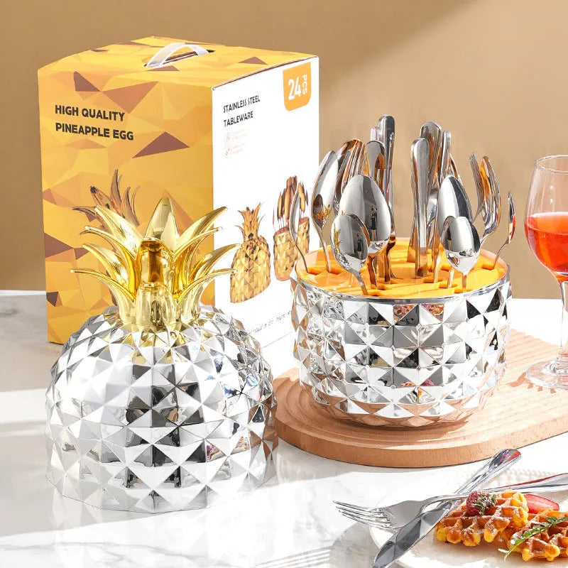 Fashion stainless steel 24-piece tableware set with mirror polish and pineapple egg design in gold finish on a dining table