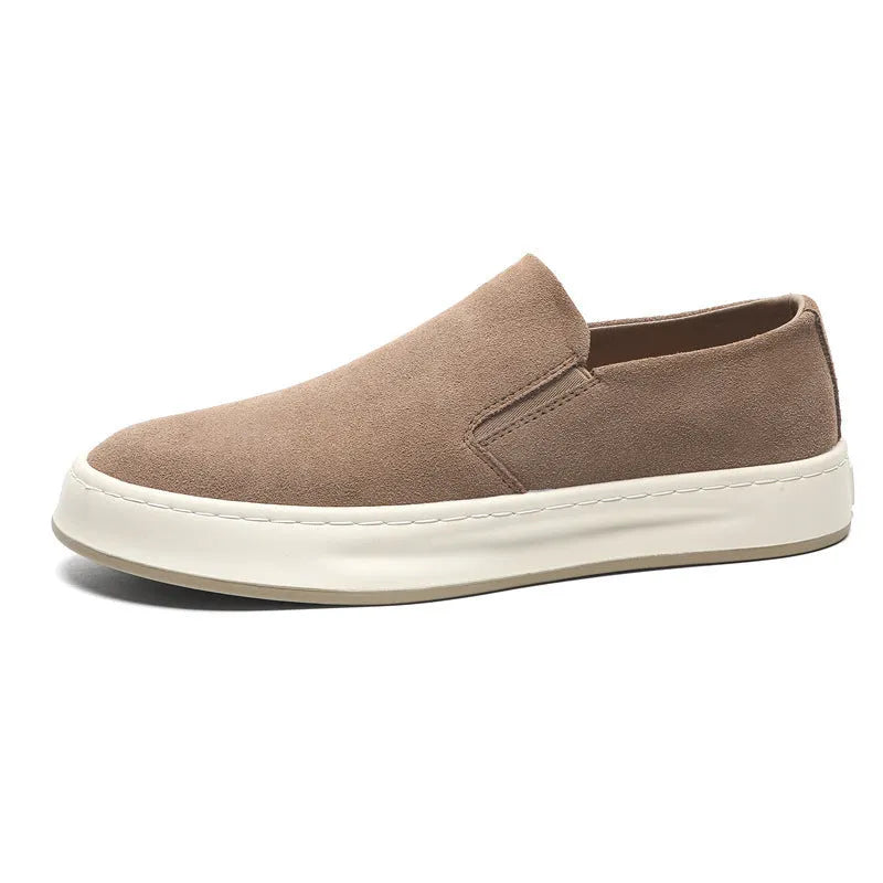 Men's grey slip-on casual shoes with round toe design and visible stitching details