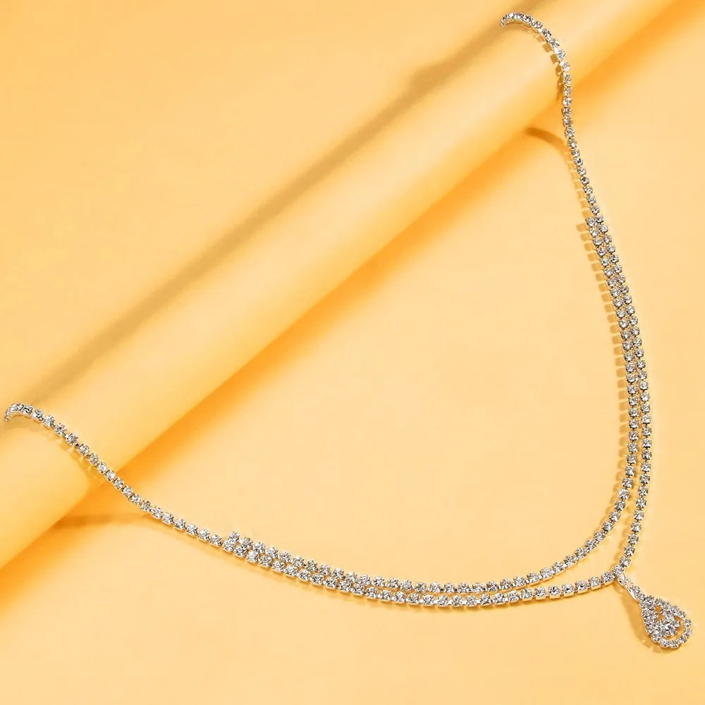 Gold rhinestone water drop pendant waist chain with lobster clasp, 115cm length