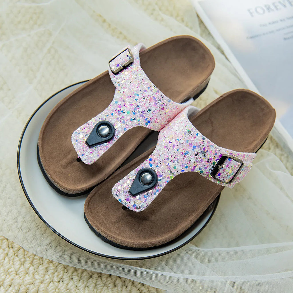Women's cork flip-flops with frosted metallic artificial leather upper and textured PVC sole.