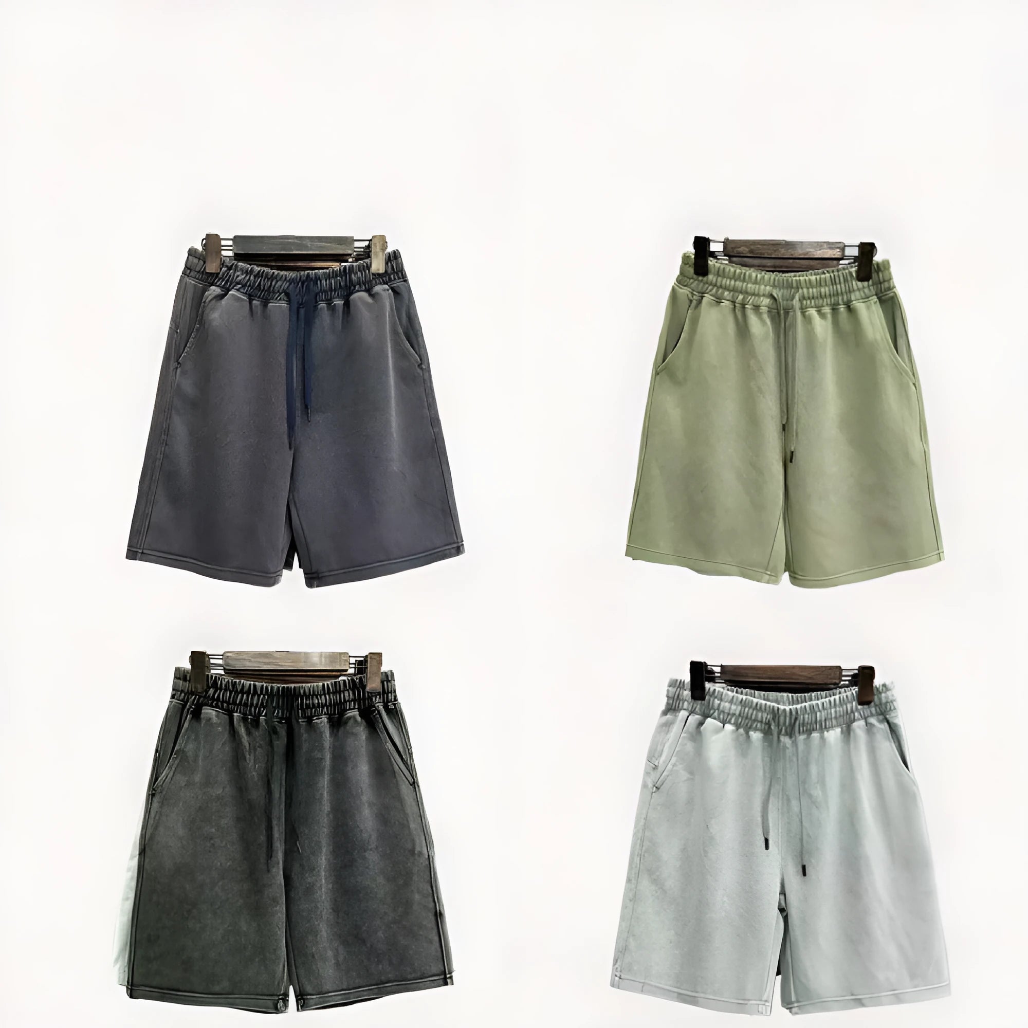 Men's solid colour cotton shorts with distressed detailing on the leg, shown in a loose, straight-leg fit.