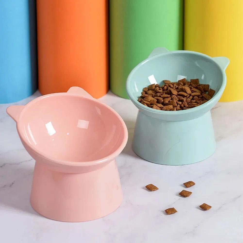 Ergonomic tilted raised plastic cat food bowl in blue with non-slip base for anti vomiting feeding