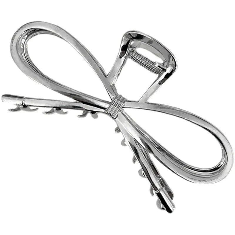 Women's bow barrette hair grip in gold or silver with Korean style design