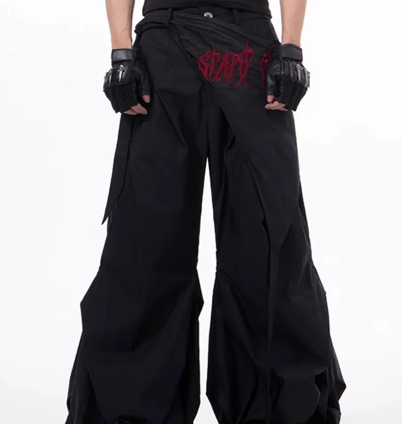 Boy modelling black wide-leg Korean-style summer pants on a casual backdrop.