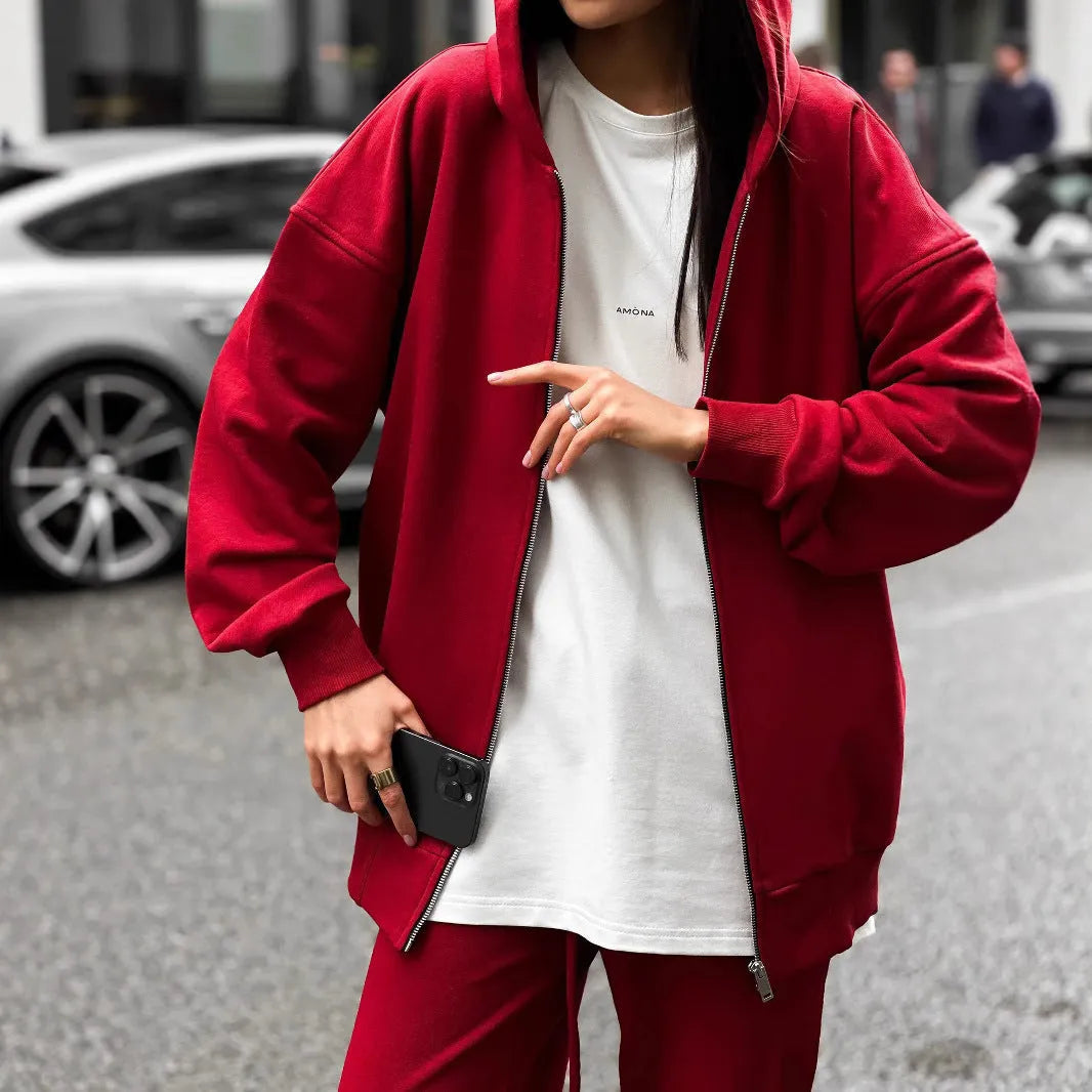 Women's red street style two-piece set with long-sleeved coat and matching trousers, loose fit.