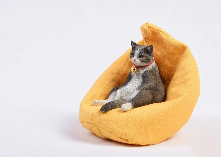 Small 7.5cm lazy cat ornament with sofa on car dashboard