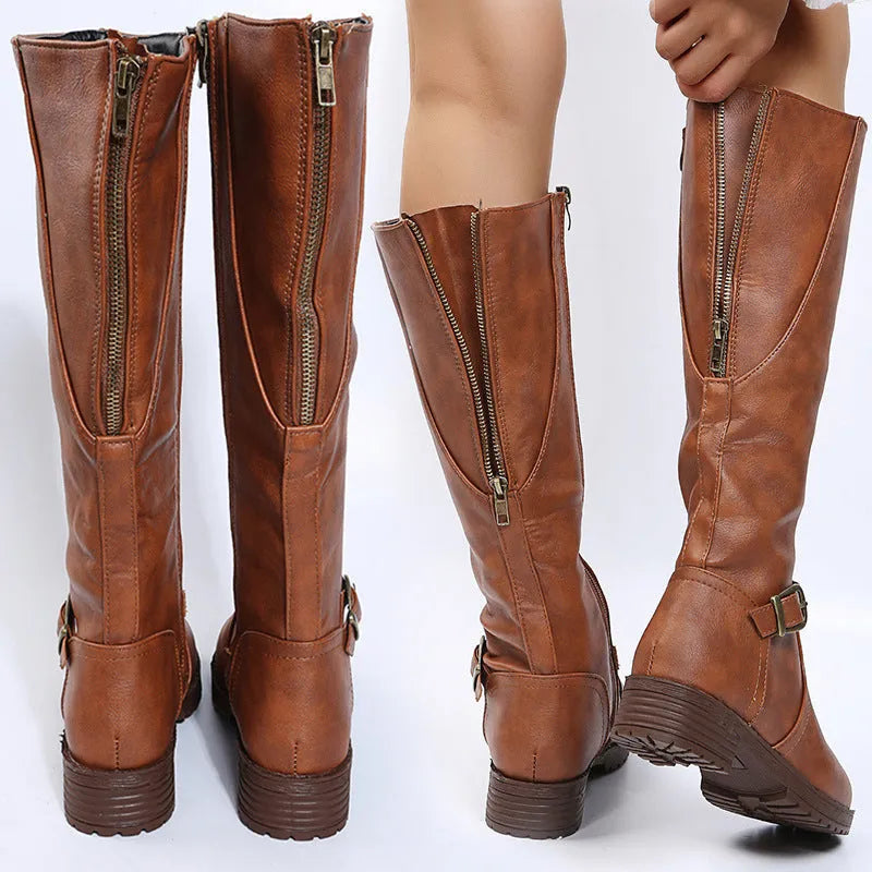 Women's yellow knight high boots with buckle details on shaft and a square heel.