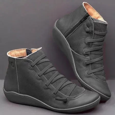 Women's casual ankle booties with a round toe, wedge heel, PU upper, and rubber sole in a selection of colours.