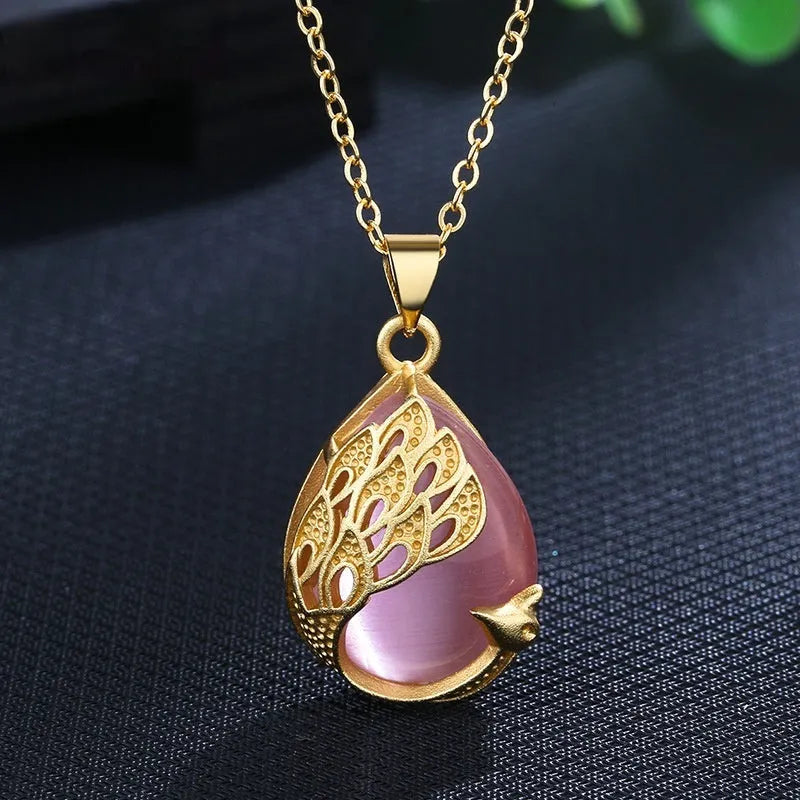 Green chalcedony imitation crystal peacock pendant on copper electroplated base with fu character element