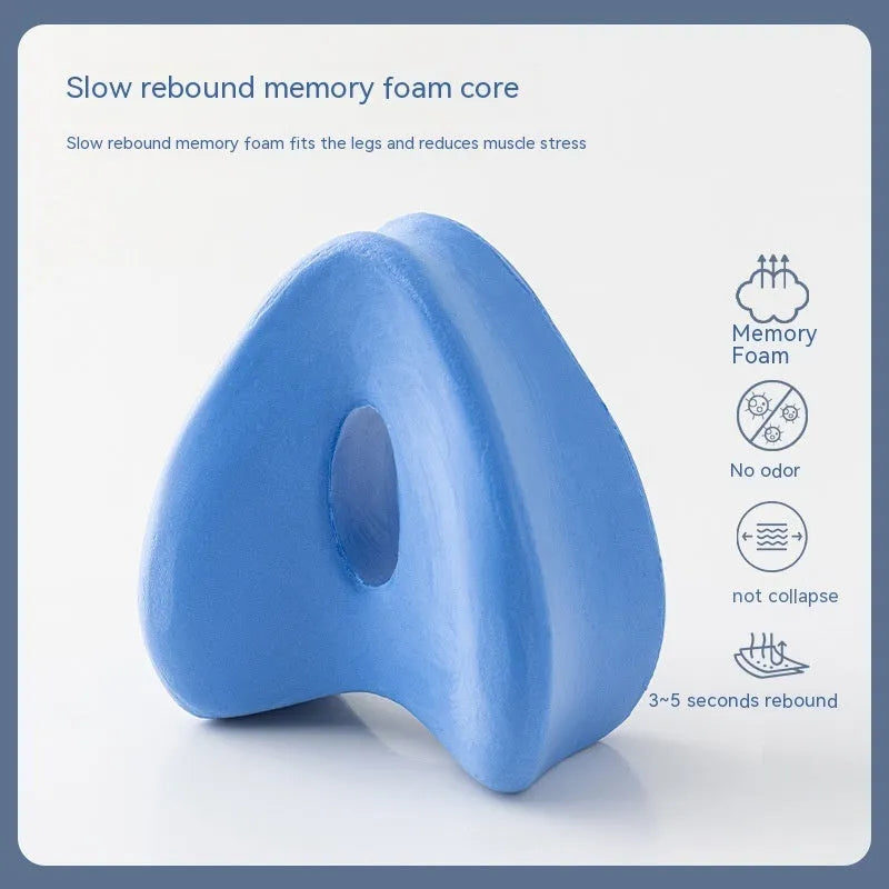 Love heart-shaped dark blue memory foam leg pillow for adult knee and leg support.