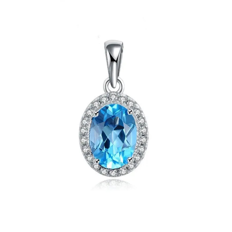 Four-piece 925 sterling silver jewellery set with blue topaz gemstones in a geometric design, showing earrings, ring, pendant and necklace.
