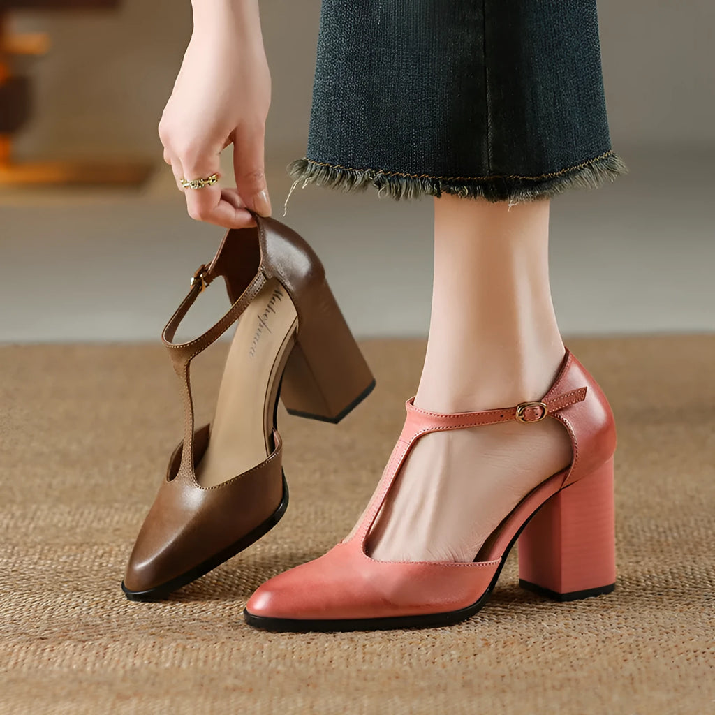 Women's pink retro Mary Jane shoes with a pointed toe, buckle strap, and cowhide leather upper.