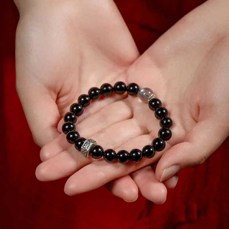 Obsidian zodiac bracelet with 8mm beads showing ethnic styling and traditional Chinese animal symbolism