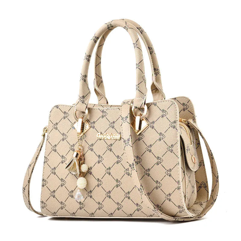 Women's geometric pattern print messenger bag in PU leather with zipper closure and internal organisers.