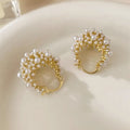 Gold floral basket-shaped women's earrings made from small rice beads with pearl inlay on copper.