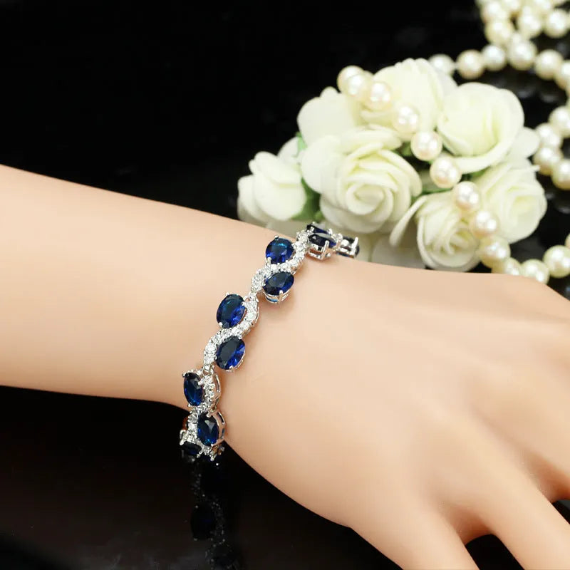 Electroplated copper bracelet with zircon stones in geometric design showing gold colour finish