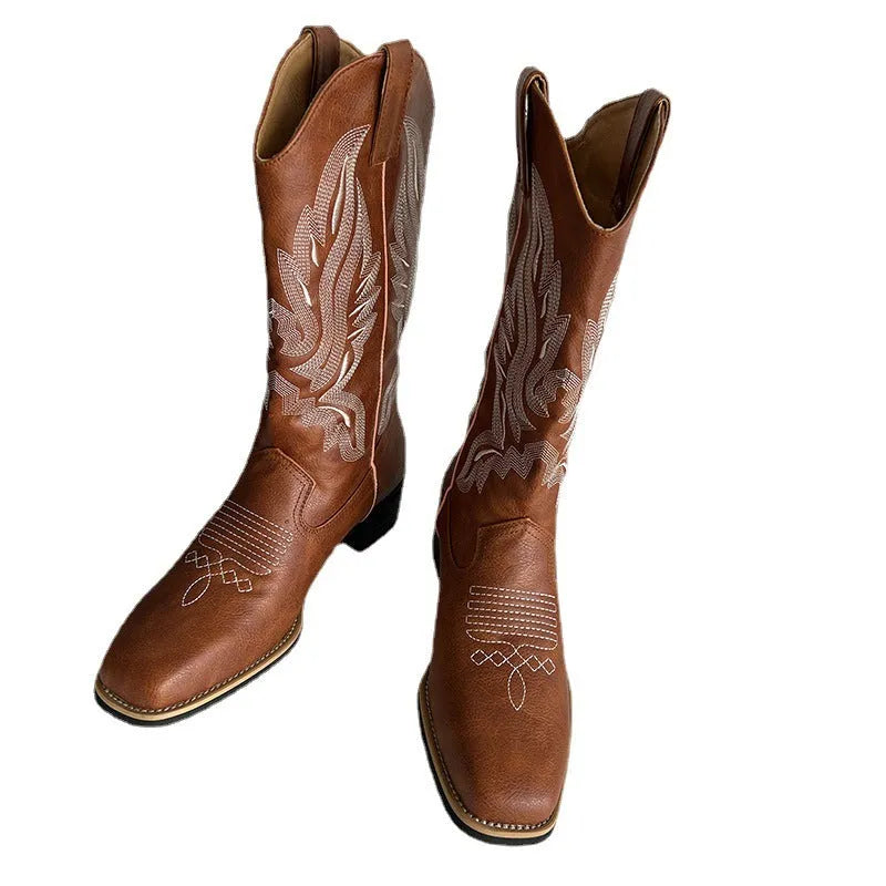 Brown women's mid-calf Martin boots with embroidered detail, round toe, and low square heel.