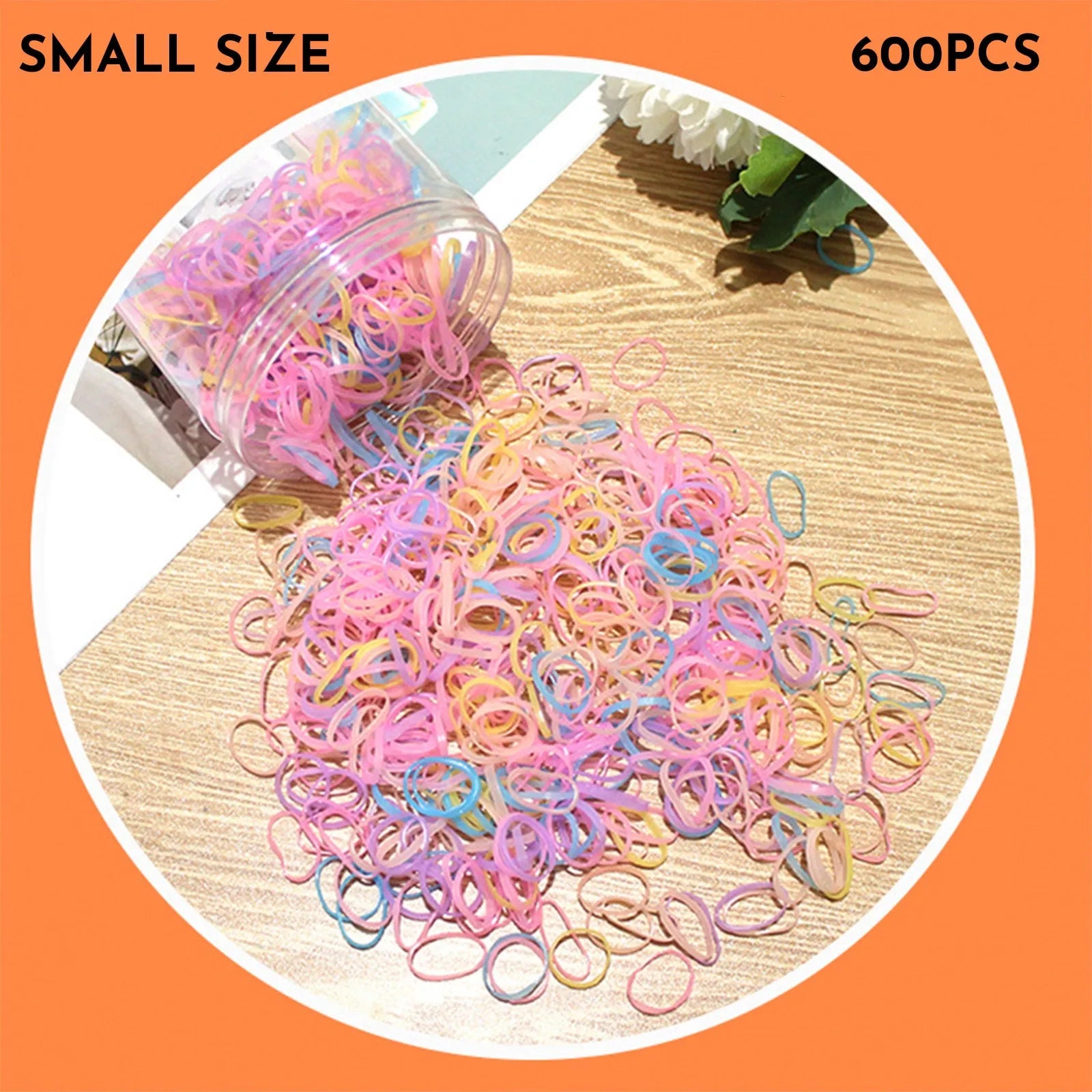 Open reusable container showing hundreds of thin, colourful TPU baby hair ties for toddlers.