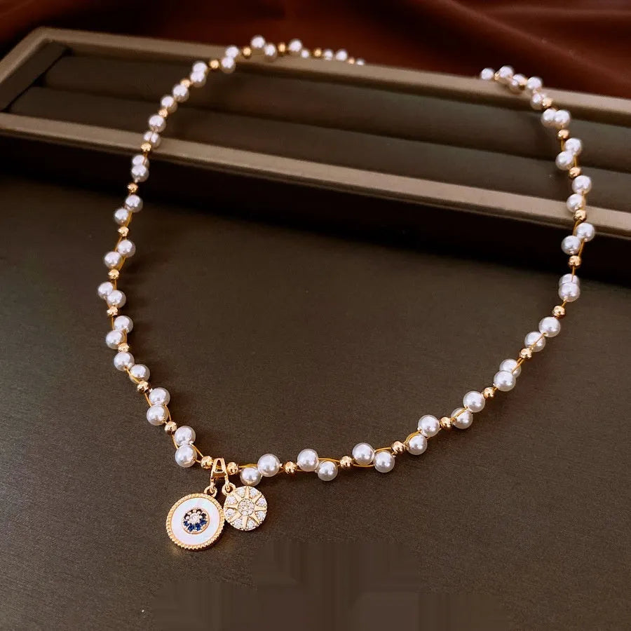 Gold electroplated pearl pendant necklace with adjustable 41-50cm clavicle chain and zircon inlaid details