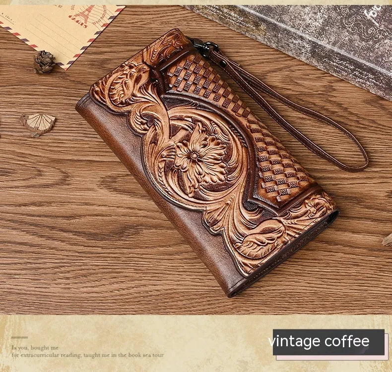 Women's brown tri-fold leather wallet with embossed floral pattern showing open compartments