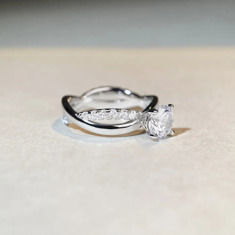Silver geometric cross ring with 1 karat moissanite centre stone and twisted arm band