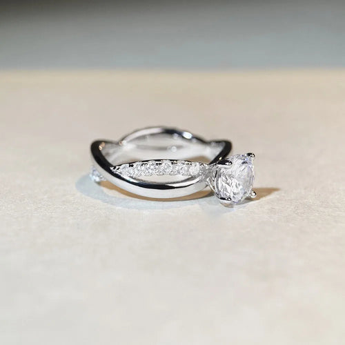 Silver geometric cross ring with 1 karat moissanite centre stone and twisted arm band