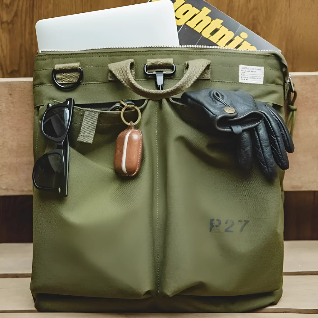 Marden Tooling medium canvas messenger bag in charcoal black with a shoulder strap and hard handle.