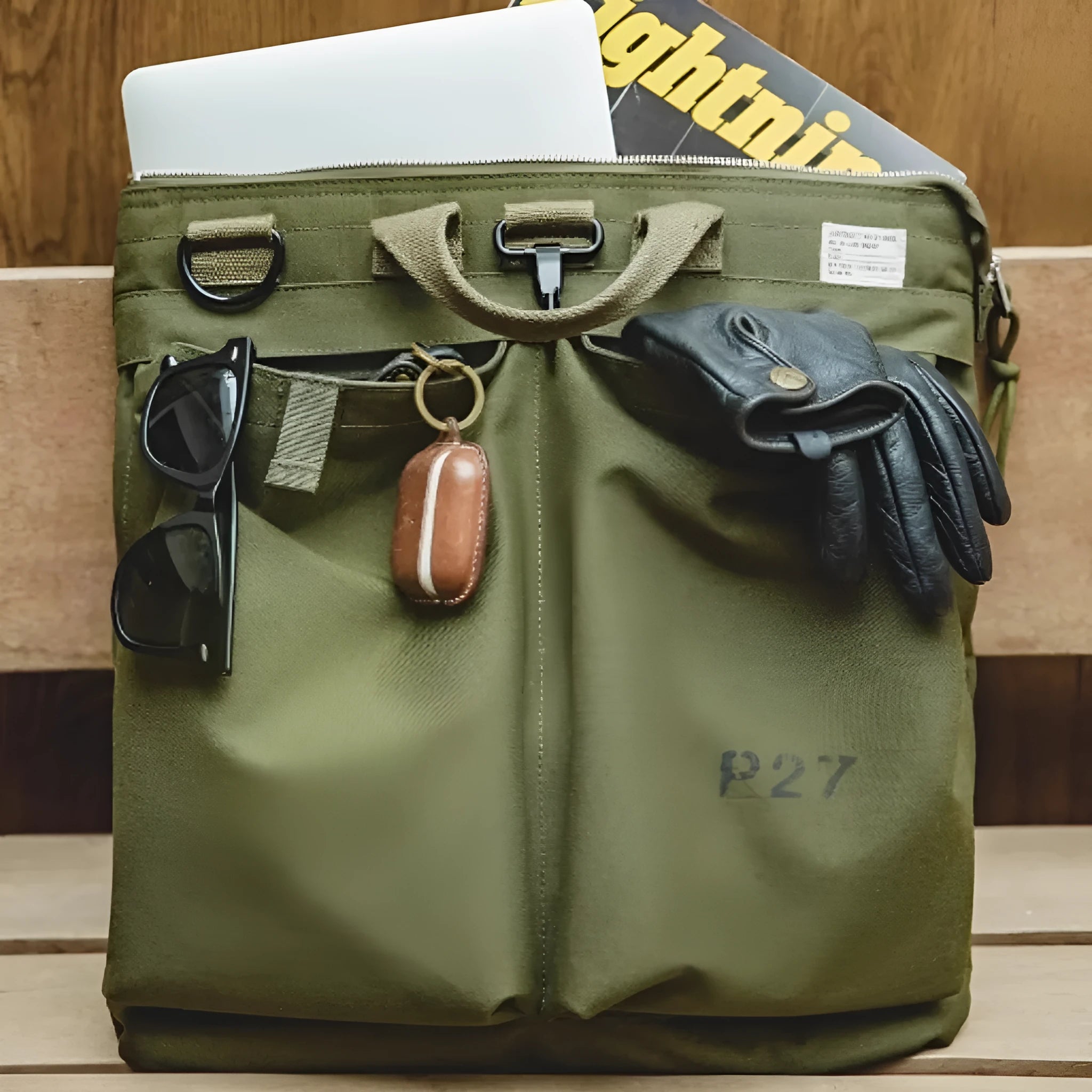 Marden Tooling medium canvas messenger bag in charcoal black with a shoulder strap and hard handle.