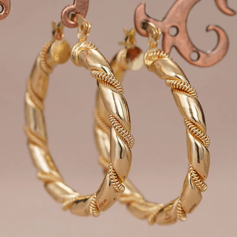 Geometric copper earrings for women in golden colour with ring and line design elements