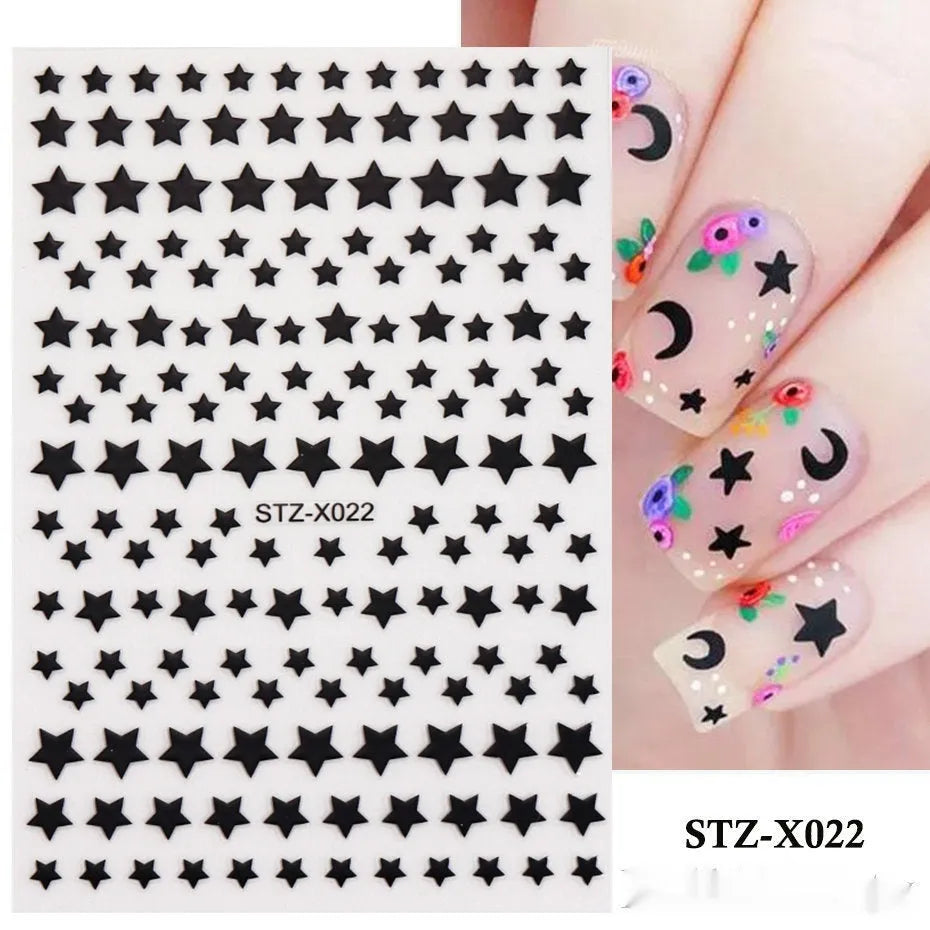 Sheet of black and silver strip nail art stickers with cartoon and love heart designs