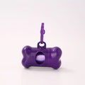 Bone-shaped pet garbage bag dispenser in new PP material, 8cm long and 5cm wide, on a table
