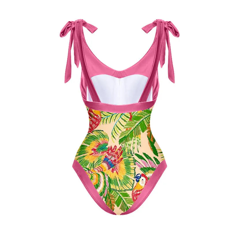 Women's pink floral print one-piece swimsuit with v-neck, covered belly, and attached thin skirt.