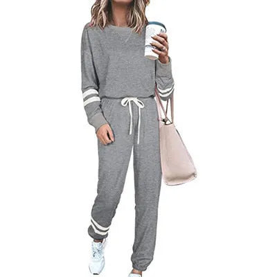 Women's plus size casual two-piece suit set in a solid colour, showing loose-fitting long sleeve top and trousers.