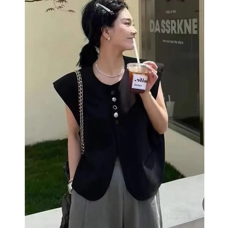 Women's loose fit polyester vest in milky white, featuring a short length and a front pocket.