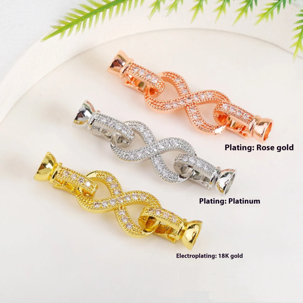 Small gold plated buckle clasp for DIY jewellery making on a white background.