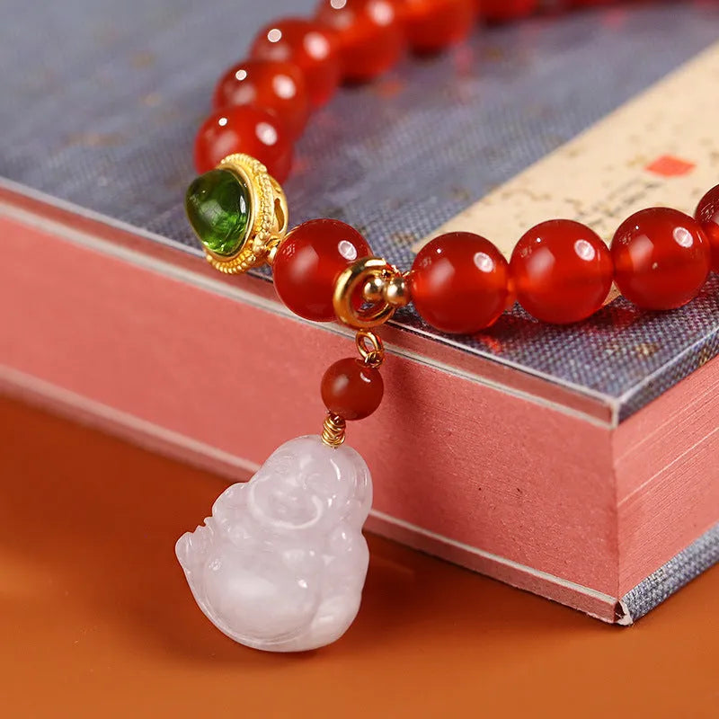 Women's handcrafted amber bracelet with red agate stones and gold Maitreya Buddha jade pendant