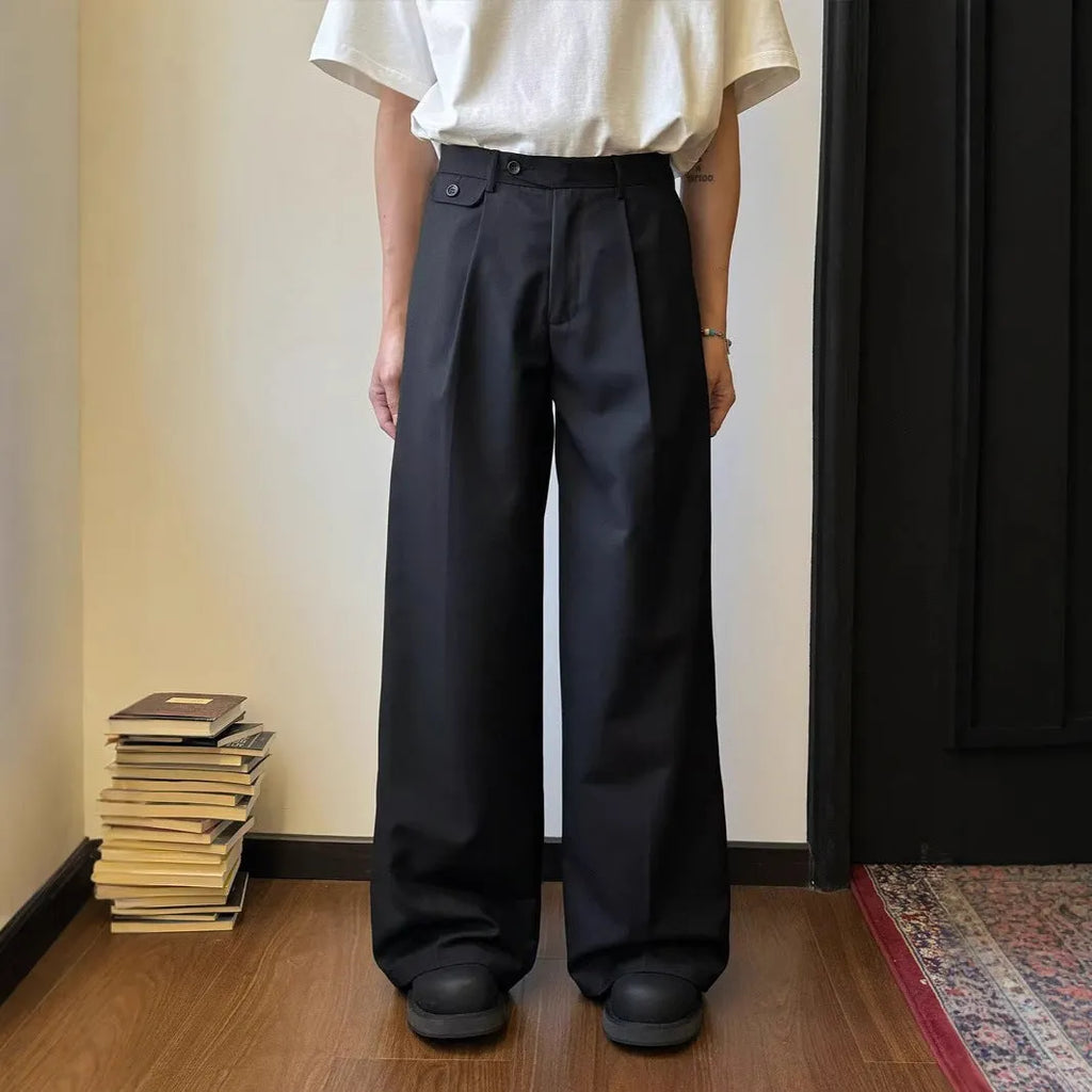 Men's straight-leg casual trousers in black with wide-leg draping silhouette on hanger