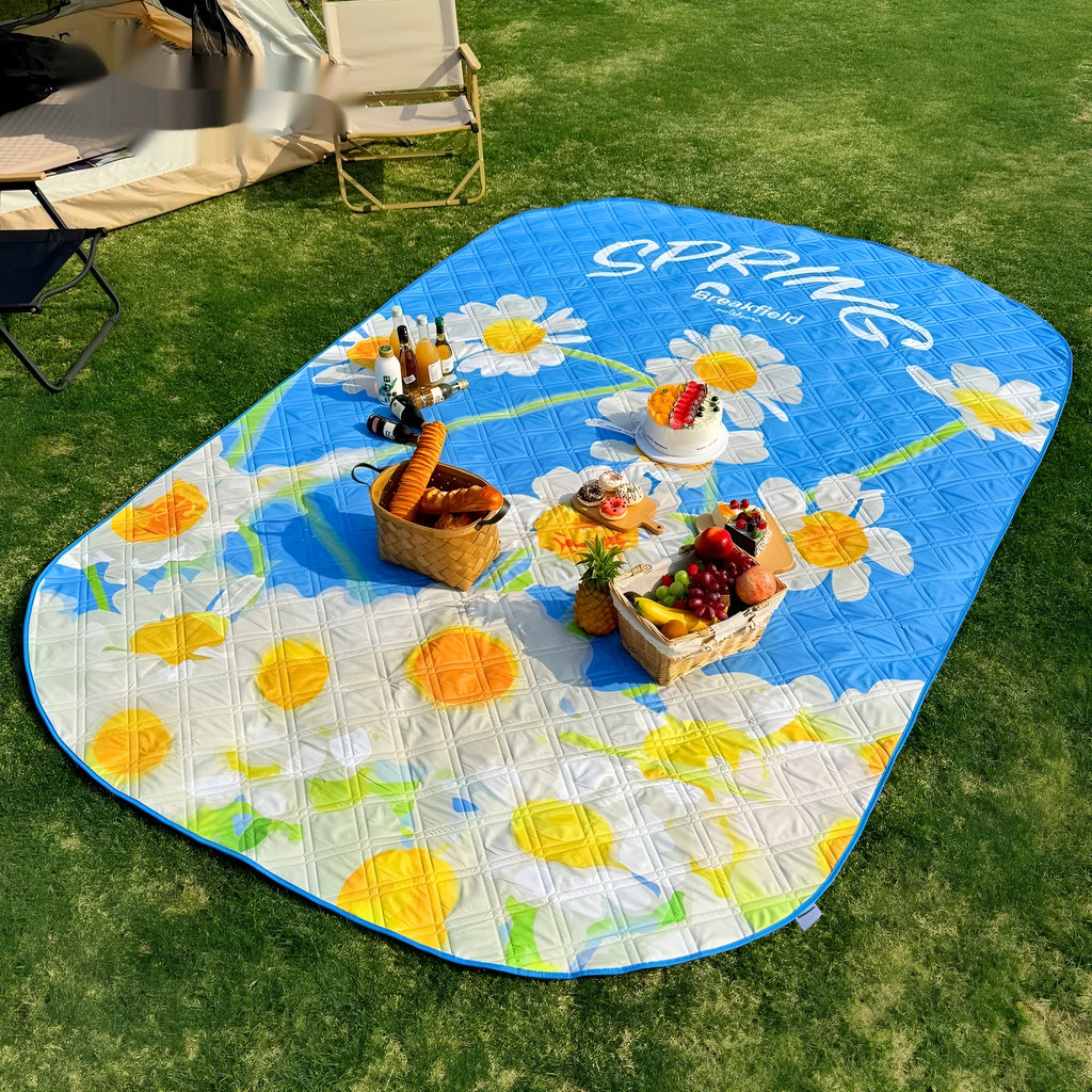 Waterproof outdoor picnic mat with brushed fabric texture showing seasonal colour options