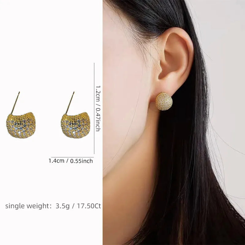 Gold and white geometric drop earrings with diamond-effect golden beans ear clips and sphere details