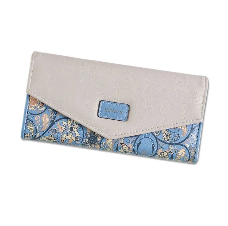 Women's three-fold leather wallet with buckle closure in black, blue, green, melon red or violet