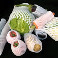 White foam net shockproof protective cover for fruit such as apples and peaches.
